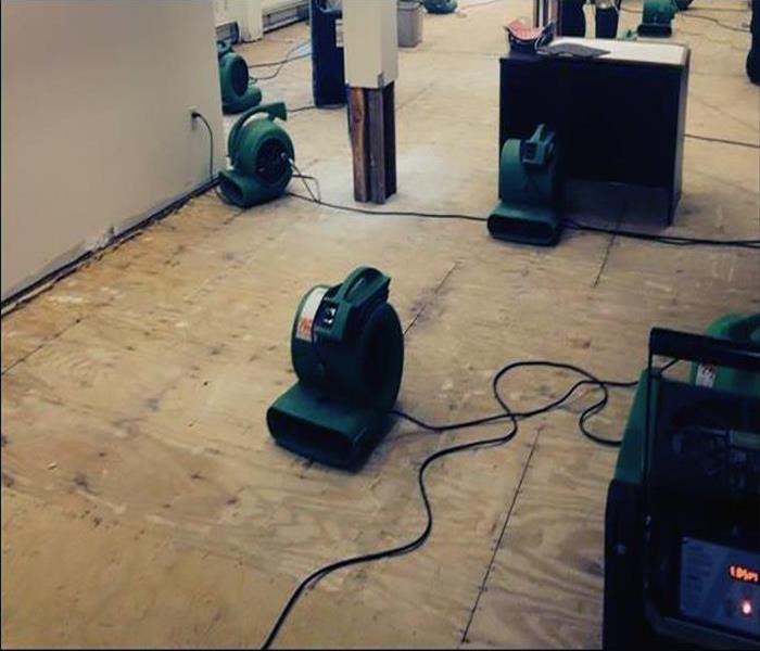 green drying equipment in a building with floors removed